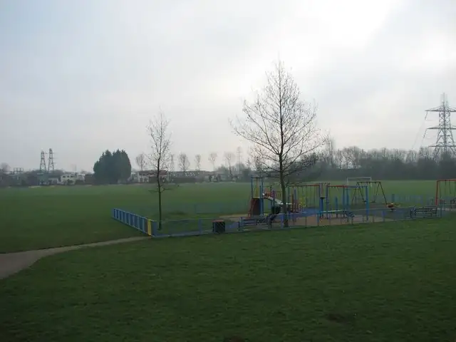 Empty colorful playground equipment on a wood-chip surface