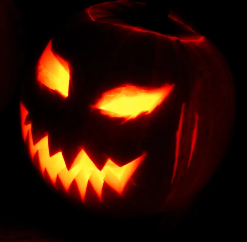 An orange jack-o'-lantern with a carved face, glowing from inside